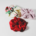 Red scrunchie, floral scrunchie and pink scrunchie
