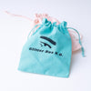 Drawsstring bags with the glitter box logo on it in teal and pink