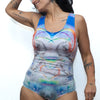 Model wearing Jessica Bizer swimsuit in psychedelic unicorn
